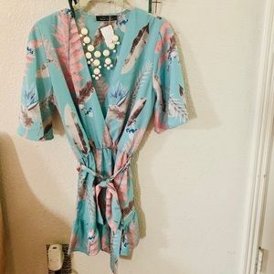 Romper with leaf and flower print. small. NWT